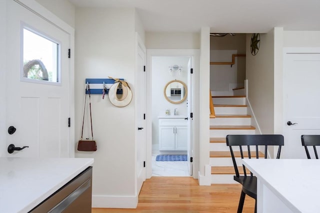 6 Macdonald Ter Unit E, Scituate, MA 02066 - foyer entrance featuring stairway, baseboards, and light wood-style floors