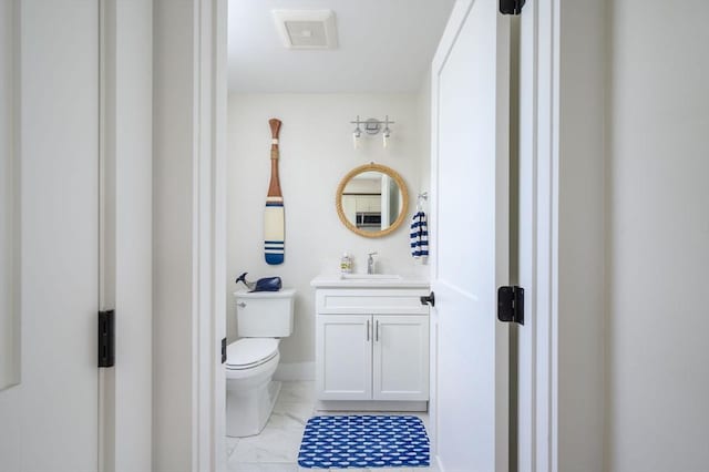 6 Macdonald Ter Unit E, Scituate, MA 02066 - bathroom featuring vanity, toilet, and marble look tile flooring