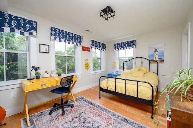 6 Macdonald Ter Unit E, Scituate, MA 02066 - bedroom with wood finished floors, an office area, and baseboards