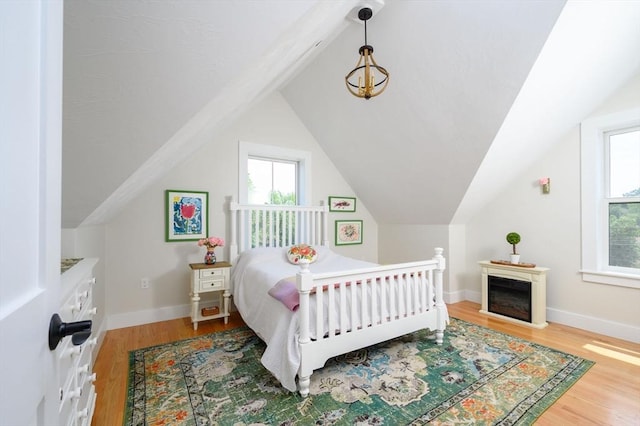 6 Macdonald Ter Unit E, Scituate, MA 02066 - bedroom with wood finished floors, lofted ceiling, and baseboards