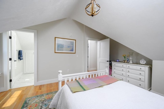 6 Macdonald Ter Unit E, Scituate, MA 02066 - bedroom with light wood finished floors, lofted ceiling, connected bathroom, and baseboards