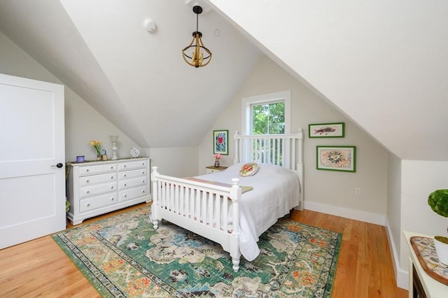 6 Macdonald Ter Unit E, Scituate, MA 02066 - bedroom with light wood-type flooring, lofted ceiling, and baseboards