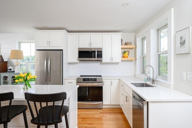 6 Macdonald Ter Unit E, Scituate, MA 02066 - kitchen featuring appliances with stainless steel finishes, a sink, and white cabinets