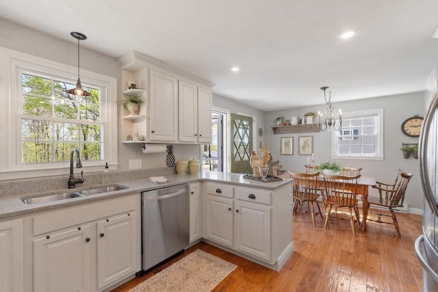 kitchen with a sink, plenty of natural light, and dishwasher