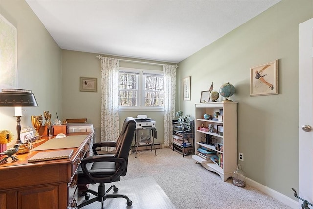 home office featuring baseboards and light carpet