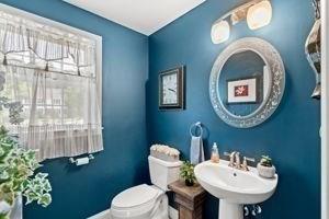 5 Comanche Cir Unit 5, Haverhill, MA 01835 - half bathroom with toilet, a sink, and baseboards