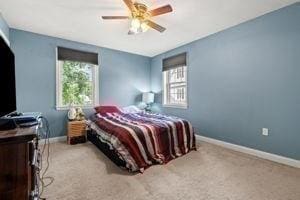5 Comanche Cir Unit 5, Haverhill, MA 01835 - carpeted bedroom with multiple windows, baseboards, and a ceiling fan