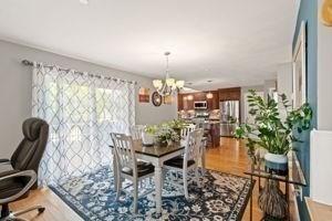 5 Comanche Cir Unit 5, Haverhill, MA 01835 - dining room featuring a chandelier and wood finished floors