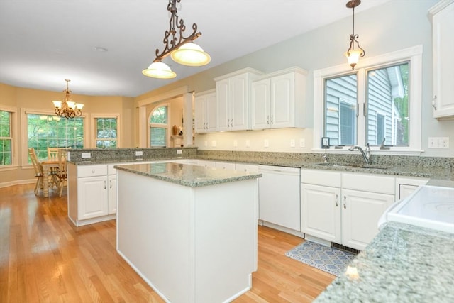 17 Stable Way, Medway, MA 02053 - kitchen with white dishwasher, a sink, light wood-style flooring, and white cabinets