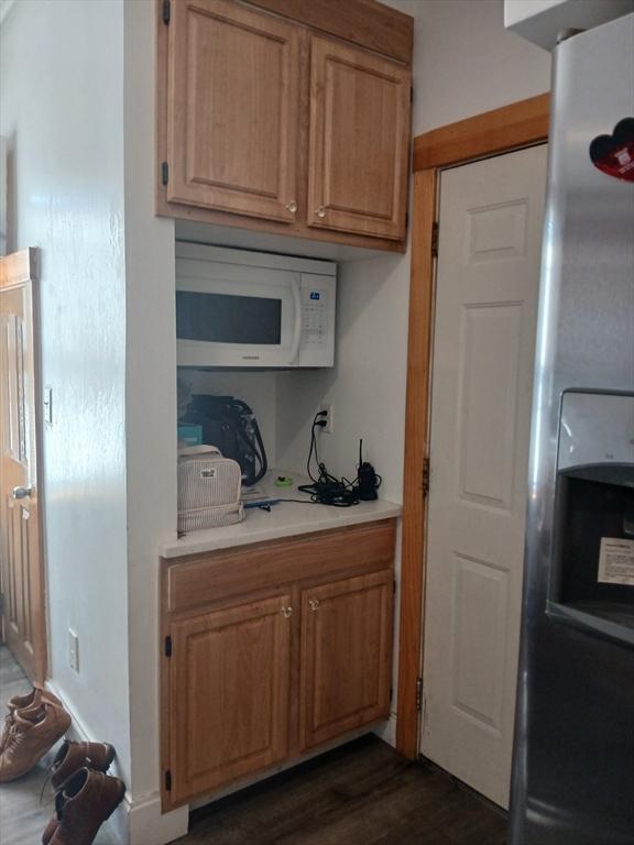 347 Summer St, Lynn, MA 01905 - kitchen featuring white microwave, light countertops, stainless steel refrigerator with ice dispenser, and dark wood finished floors