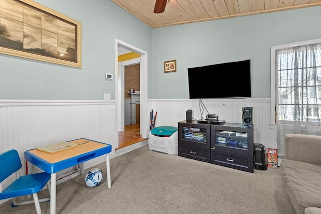 85 Flint St, Salem, MA 01970 - living room with a wainscoted wall, carpet floors, ceiling fan, and wood ceiling