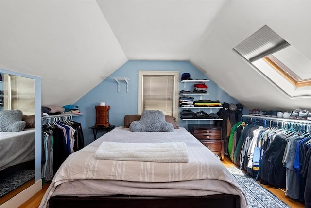 85 Flint St, Salem, MA 01970 - bedroom with wood finished floors, vaulted ceiling, and a skylight