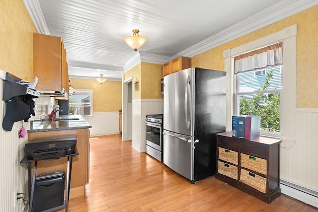 85 Flint St, Salem, MA 01970 - kitchen featuring stainless steel appliances, a baseboard heating unit, wainscoting, light wood finished floors, and ornamental molding