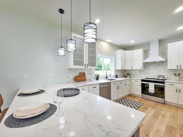 101 N Rd, Westfield, MA 01085 - kitchen with stainless steel appliances, custom exhaust hood, decorative backsplash, light stone countertops, and recessed lighting