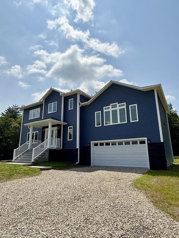 101 N Rd, Westfield, MA 01085 - view of front of property with gravel driveway, a garage, and covered porch
