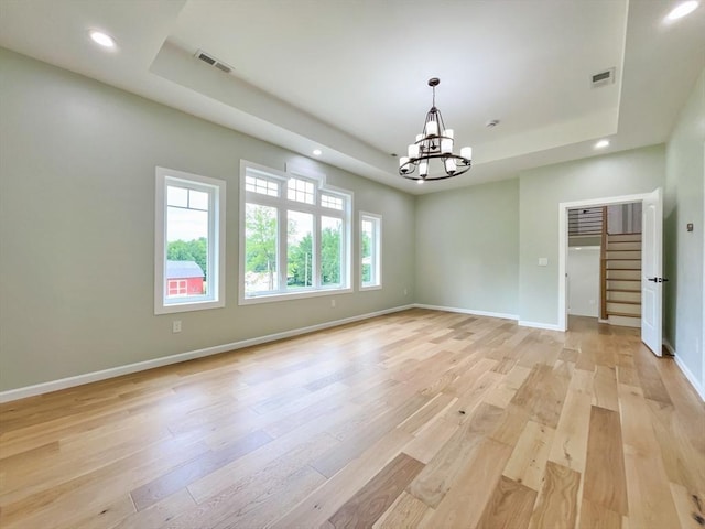 101 N Rd, Westfield, MA 01085 - spare room with a tray ceiling, a chandelier, light wood-style floors, recessed lighting, and stairs