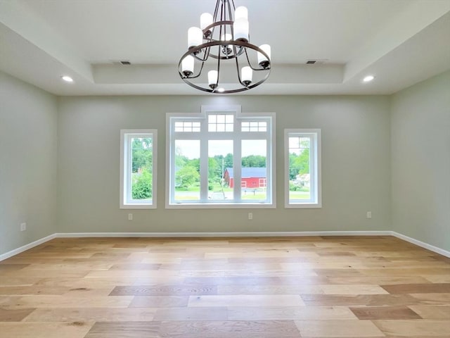 101 N Rd, Westfield, MA 01085 - unfurnished room featuring a chandelier, plenty of natural light, recessed lighting, light wood-style floors, and a tray ceiling