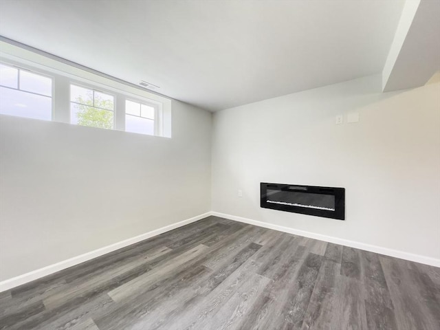 101 N Rd, Westfield, MA 01085 - unfurnished living room with a glass covered fireplace and wood finished floors