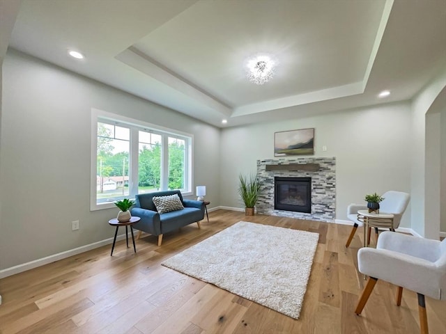 101 N Rd, Westfield, MA 01085 - living area with a raised ceiling, a glass covered fireplace, light wood-style floors, and recessed lighting