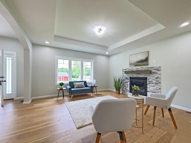 101 N Rd, Westfield, MA 01085 - living area with a raised ceiling, a fireplace, recessed lighting, light wood finished floors, and arched walkways