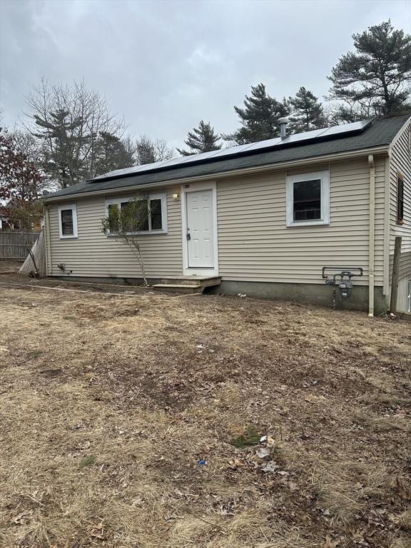 view of front of house with solar panels