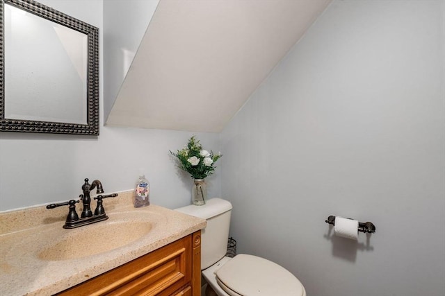 bathroom with toilet and vanity