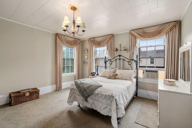bedroom with a chandelier, carpet, baseboards, and cooling unit