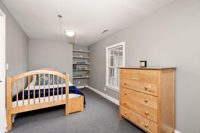 bedroom featuring carpet floors and baseboards
