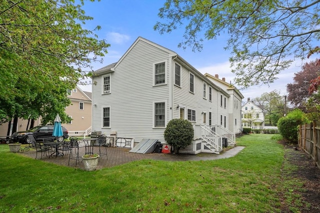 back of property with a patio and a chimney