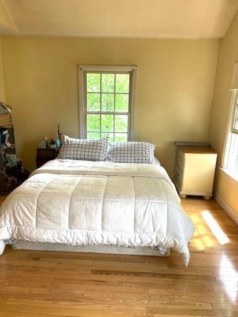 bedroom featuring light wood-style floors