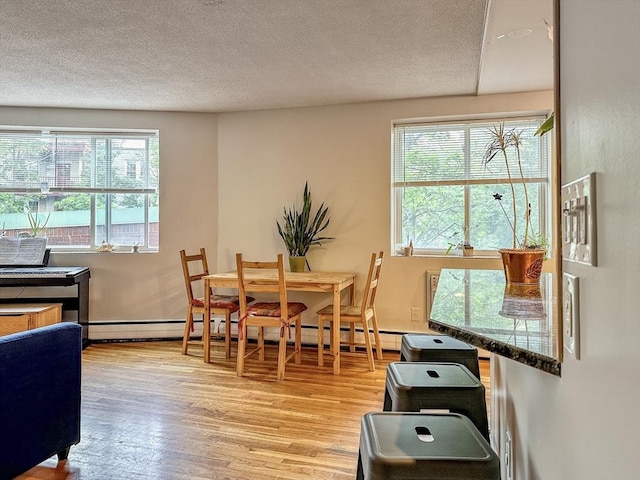 50 Green St Unit 312, Brookline, MA 02446 - dining space with light wood-style flooring and a textured ceiling