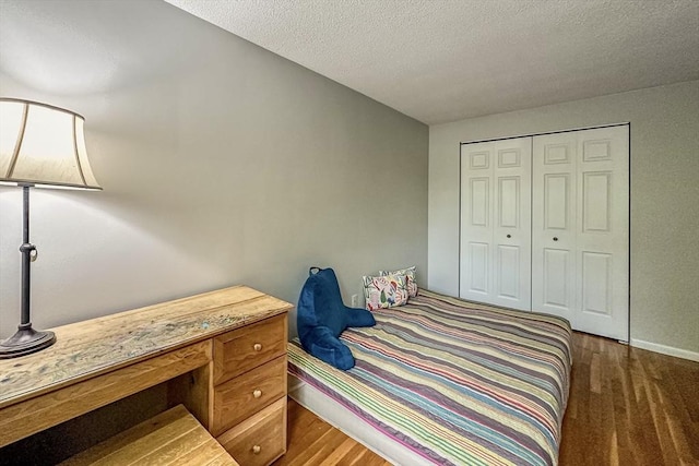 50 Green St Unit 312, Brookline, MA 02446 - bedroom with a textured ceiling and a closet