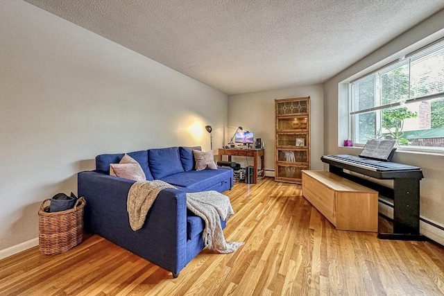 50 Green St Unit 312, Brookline, MA 02446 - living room featuring light wood-style floors and a textured ceiling