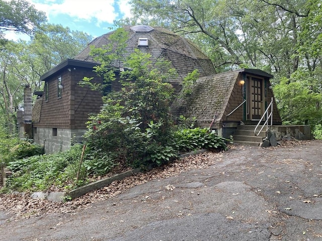 58 Concord Rd, Marlborough, MA 01752 - view of side of property with a gambrel roof, entry steps, and a chimney