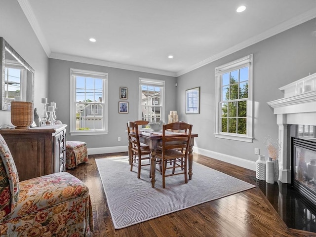 23 Chandler St, Newton, MA 02458 - dining space with a fireplace with flush hearth, baseboards, recessed lighting, ornamental molding, and wood finished floors
