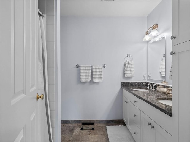 23 Chandler St, Newton, MA 02458 - full bath featuring double vanity and baseboards