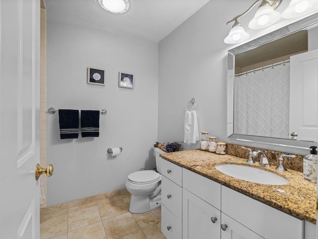 23 Chandler St, Newton, MA 02458 - bathroom with vanity, toilet, and tile patterned floors