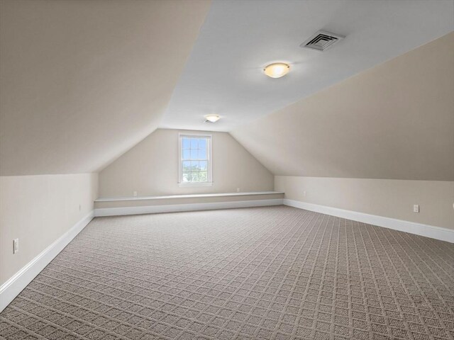 23 Chandler St, Newton, MA 02458 - additional living space with carpet flooring, lofted ceiling, and baseboards