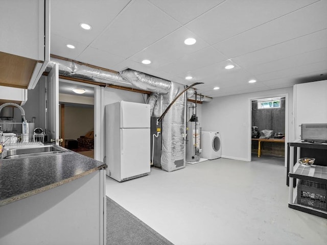 23 Chandler St, Newton, MA 02458 - basement with freestanding refrigerator, washer / dryer, gas water heater, a sink, and recessed lighting