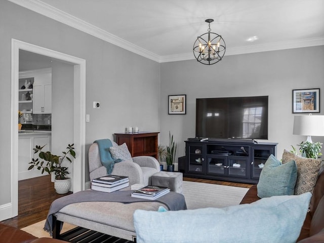 23 Chandler St, Newton, MA 02458 - living area featuring wood finished floors, a chandelier, ornamental molding, and baseboards