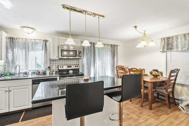 dining area with light wood finished floors