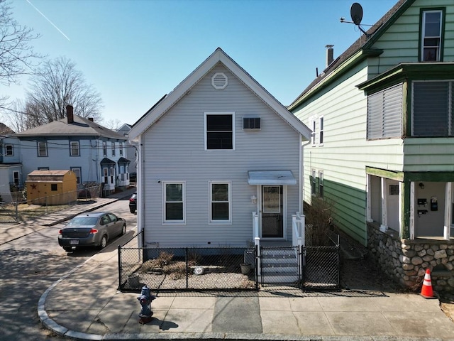 view of front of house featuring fence