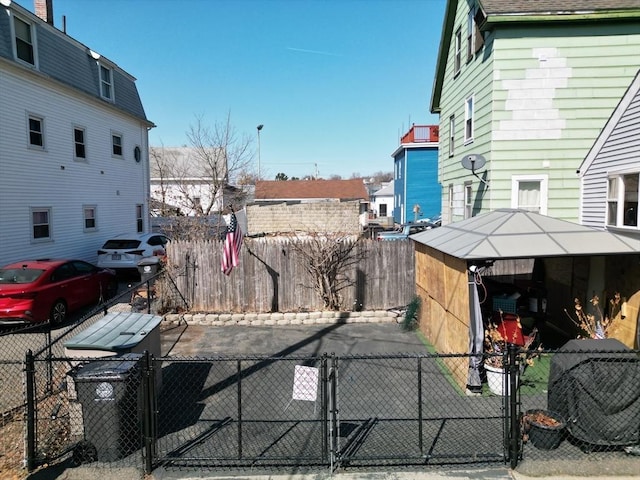 view of yard featuring a gate, cooling unit, and a fenced front yard