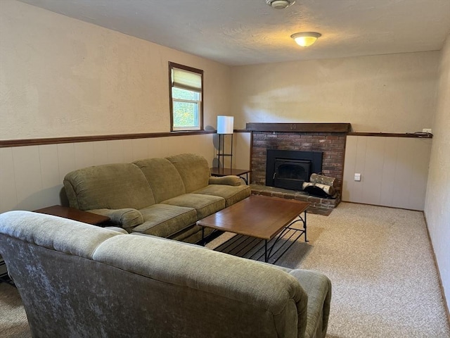 69 Hickory Dr, Raynham, MA 02767 - living room with carpet flooring, wainscoting, a textured wall, and a fireplace