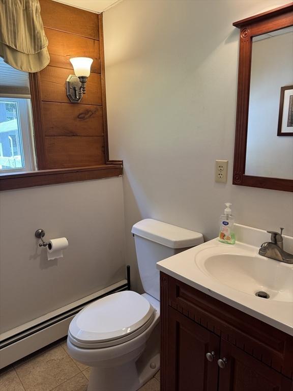 69 Hickory Dr, Raynham, MA 02767 - half bath featuring vanity and baseboard heating