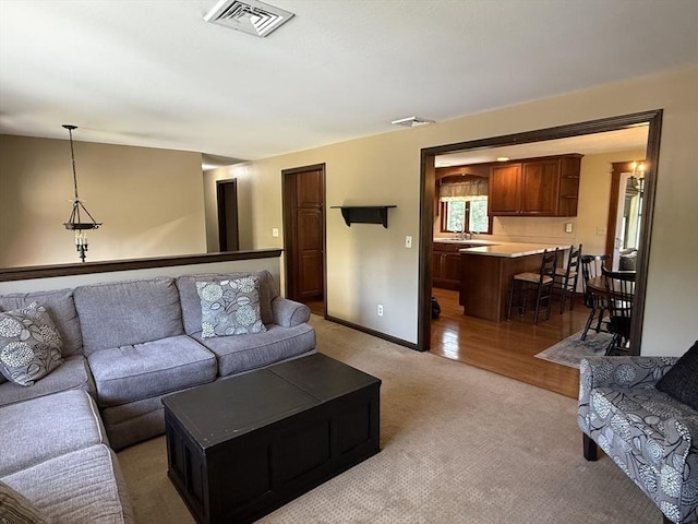 69 Hickory Dr, Raynham, MA 02767 - living area with light colored carpet and baseboards