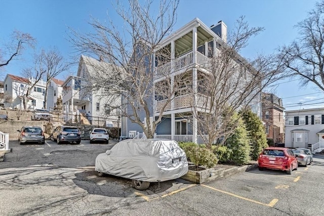 view of property featuring uncovered parking