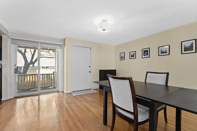 dining area featuring light wood-style floors