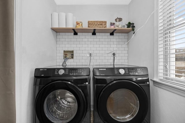 laundry area featuring washer and clothes dryer and laundry area