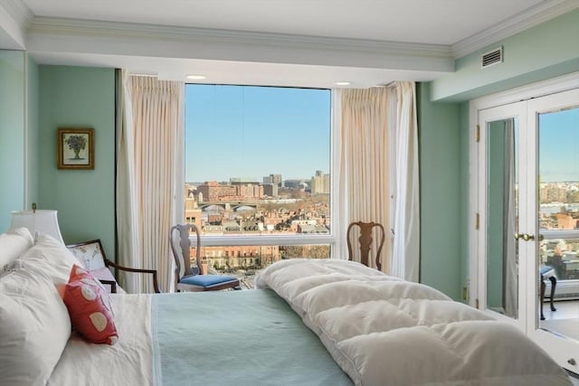 bedroom with crown molding and french doors